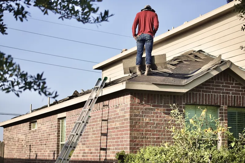 Professional roofer working on a residential roof in Mount Vista